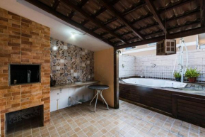 Casa de temporada com quintal interno